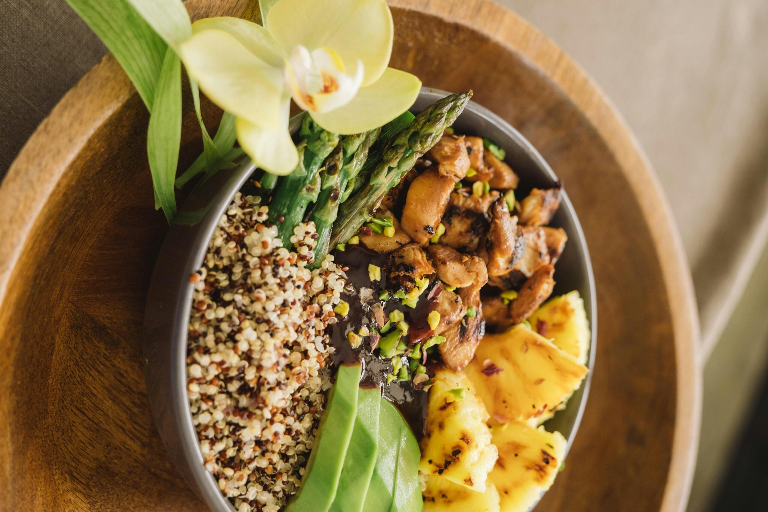 Colorful meal of grilled chicken, quinoa, and vegetables, perfect for balanced and healthy recipes