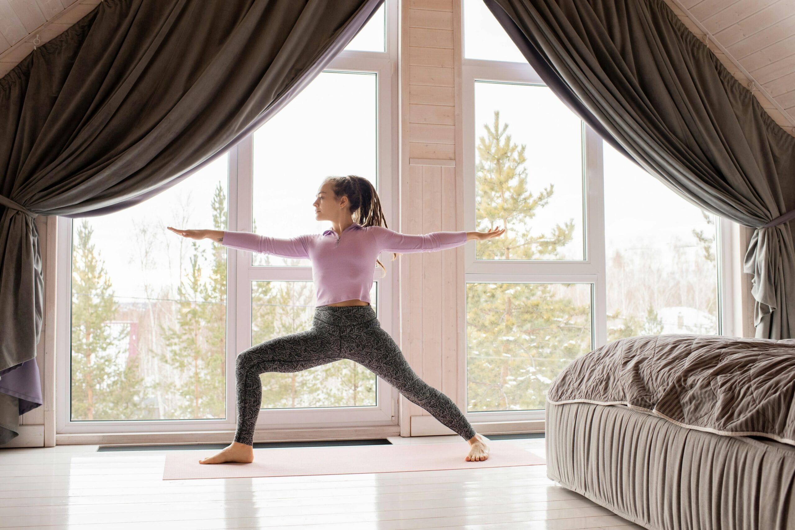 Woman doing a home workout as part of a consistent winter fitness routine.