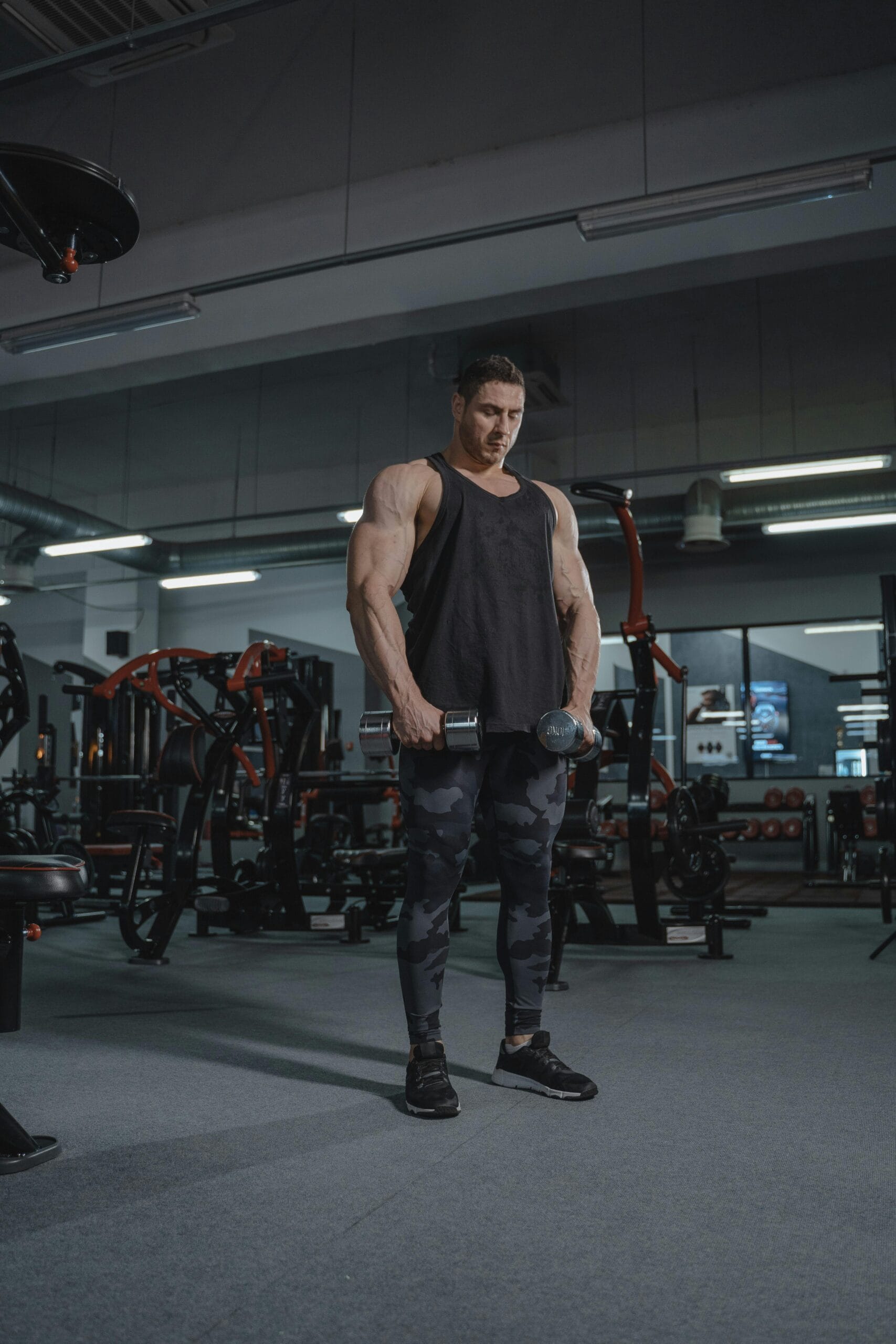 man focused on muscle engagement during weight training